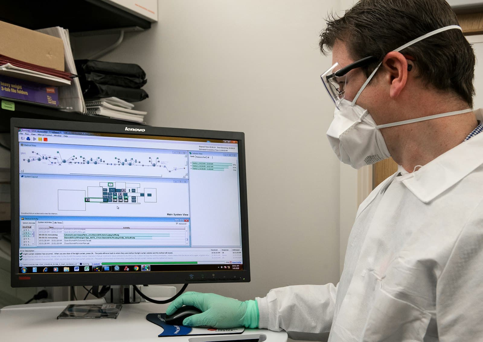 A Miller Lab researcher reviewing computational data